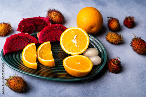 Fresh Dragon Fruit and Orange Slices on Decorative Plate