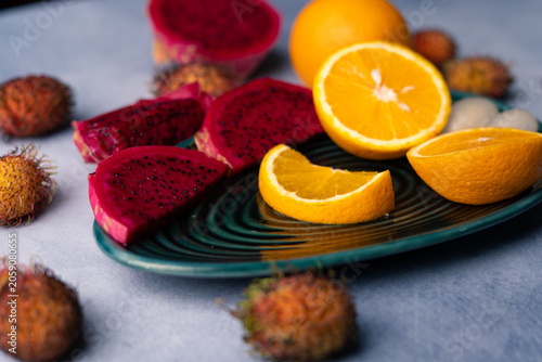 Fresh Dragon Fruit and Orange Slices on Decorative Plate