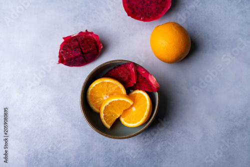 Fresh Dragon Fruit and Orange Slices on Decorative Plate