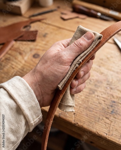 Hand edge burnishing brown leather strap with canvas cloth macro artisan finishing