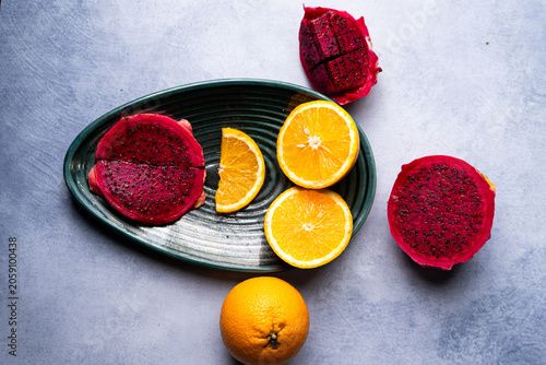 Fresh Dragon Fruit and Orange Slices on Decorative Plate