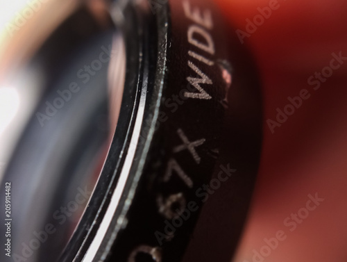 close-up view of the external lens of the smartphone camera clip