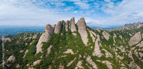 Bild auf Leinwand Aerial panoramic view of tall finger-like conglomerate rock peaks rising above g