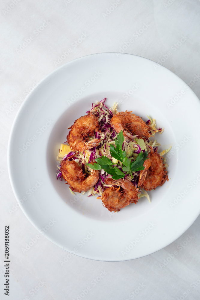 Fototapeta premium Crispy Coconut Shrimp with Tropical Slaw