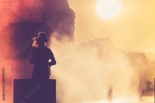 Children and people playing in a mystical fog at sunset