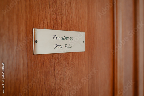 Bild auf Leinwand Wedding room door sign at a German registry office