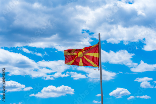 Schilderij op canvas Waving Macedonian Flag. Proud Beneath the Clouds.