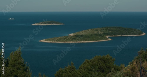 Elevated view of small Adriatic islands surrounded by deep blue sea near Primosten on the Croatian coast.