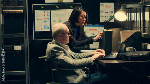 Konstfotografi Private inspector with impairment working on federal case, analyzing forensic evidence with his apprentice in archive room, investigators team trying to solve crime and uncover details