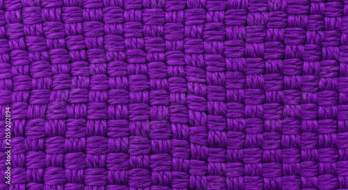 Deep purple woven fabric texture with thick thread pattern and intricate interlaced textile detail for luxury background