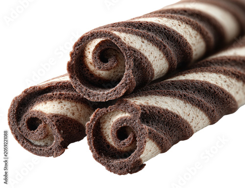 Three chocolate and vanilla roll pastries stacked diagonally