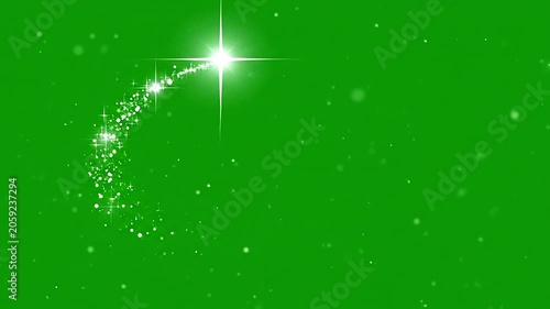 A bright shooting star with a sparkling trail on a green screen background
