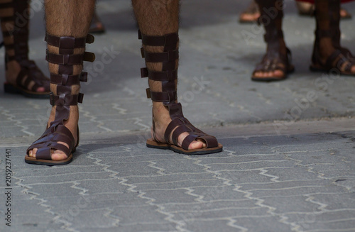 legs of people walking in the street