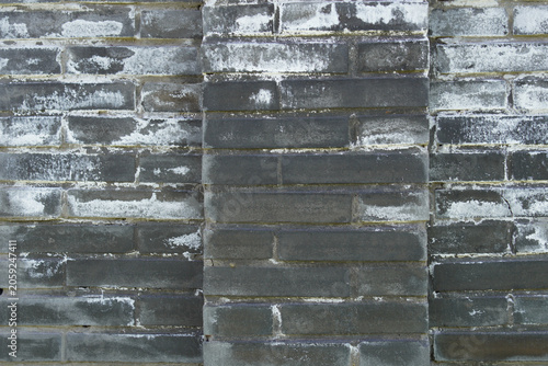 Obraz na płótnie Close-up view of old brick wall with weathered appearance