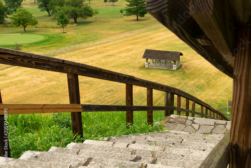 An information kiosk as seen from the top of the Miamisburg Mound in Ohio. The 65-foot tall ancient mound is within a Miamisburg city park.