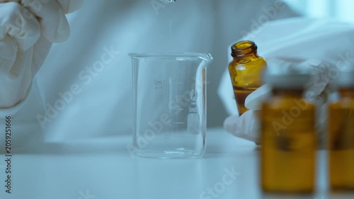 Scientist Inspecting Sterile Syringe Before Medical Laboratory Experiment.  Medical laboratory, scientific accuracy, pharmaceutical development, healthcare safety
