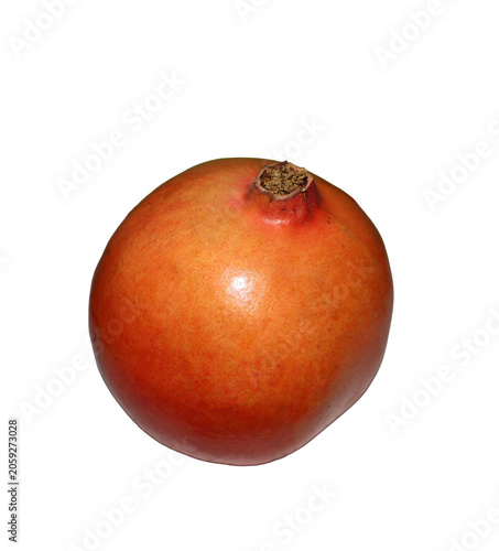Whole ripe pomegranate with stem detail during studio lighting for healthy food concepts