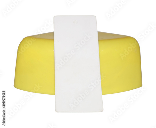 Yellow cap with white label under bright studio lighting for product presentation
