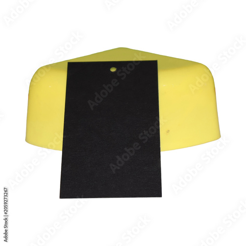 Yellow object with black tag for price or information during product display