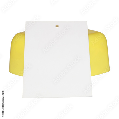 Yellow object with blank white card for text during studio photography