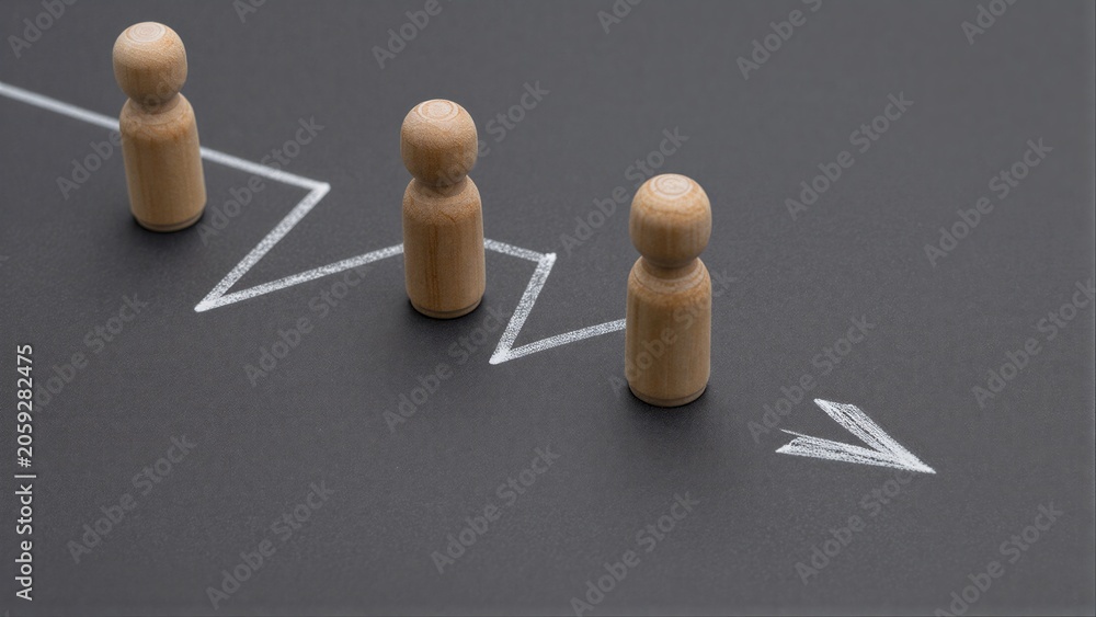 Obraz premium Wooden figures follow a rising arrow, symbolizing growth and progress.