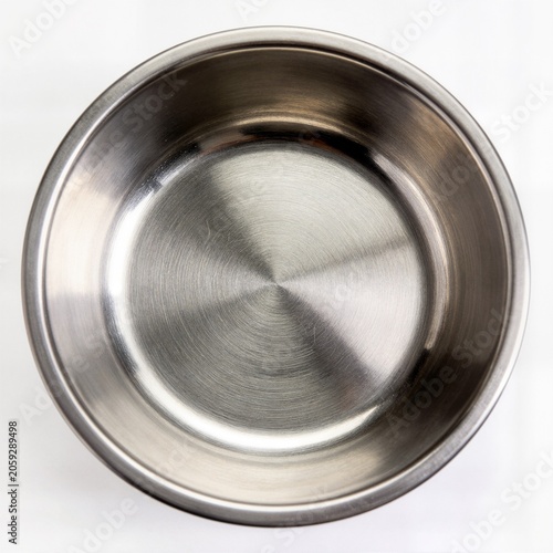Stainless steel dog bowl top view on white background ideal for pet care brand ecommerce shop product catalog and veterinary advertising