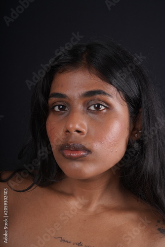 Close-Up Portrait of Dusky-Toned Woman with Natural Beauty