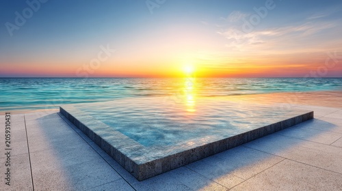 Geometric water feature overlooks ocean expanse during vibrant sunset
