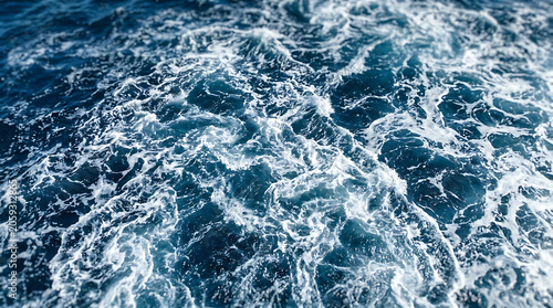 Turbulent ocean waves with white foam under natural light