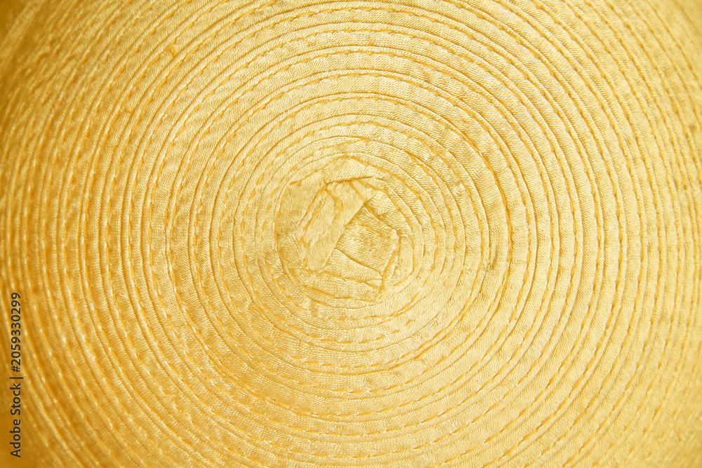 Fototapeta premium Gold yellow fabric with spiral patterns abstract on background