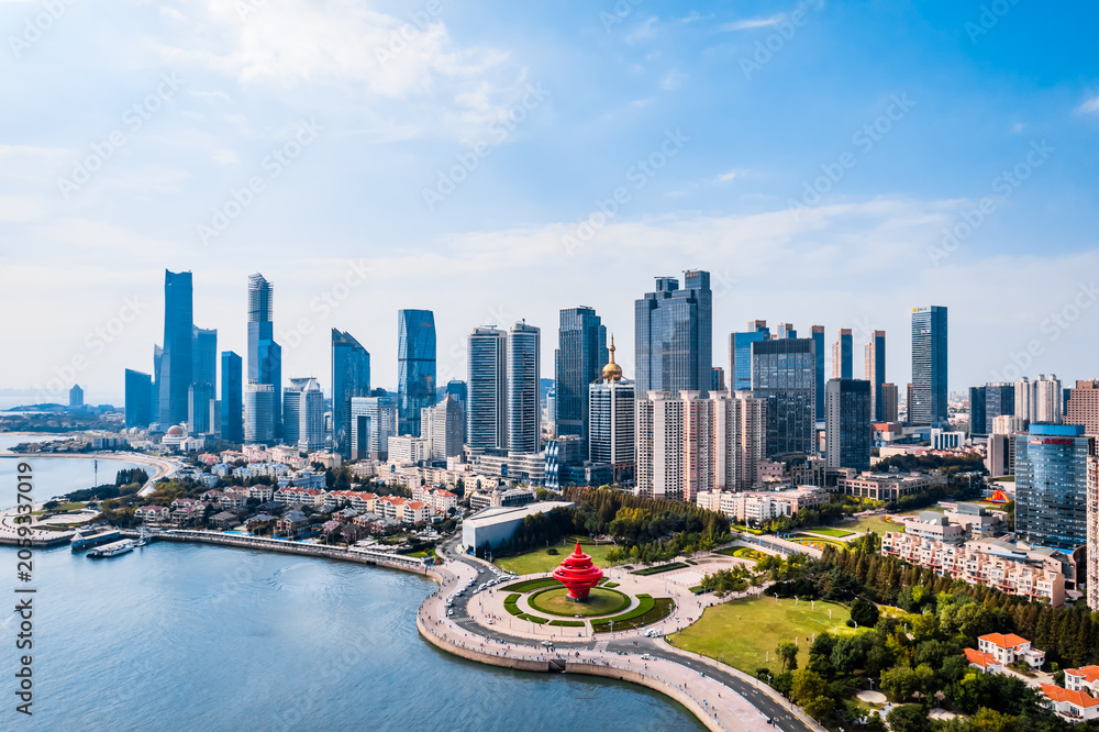Fototapeta premium Aerial view of coastline of Fushan Bay and skycrapers in Qingdao, Shandong Province, China