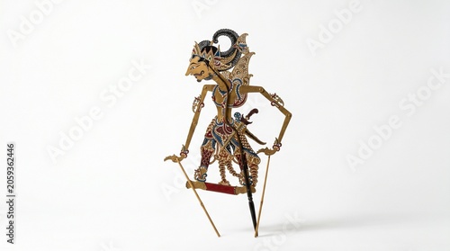 Traditional Indonesian Wayang Kulit Shadow Puppet Craftmanship Featuring Intricate Hand-Painted Details on Leather Isolated on White Background