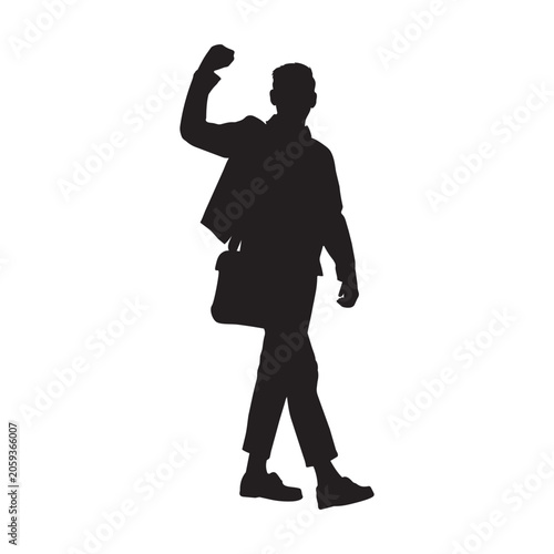 Silhouette of a Man Walking and Celebrating with a Raised Fist