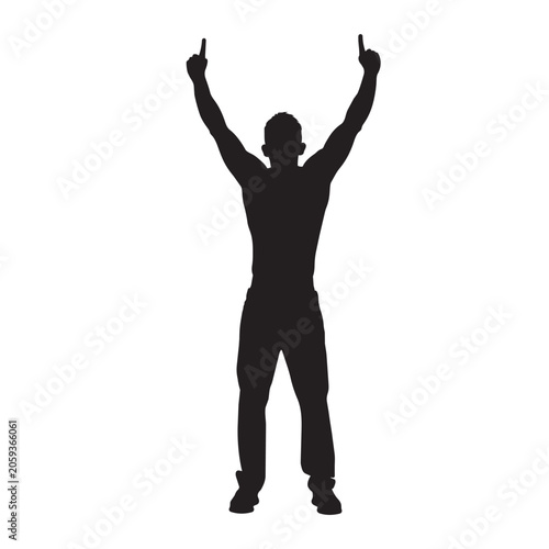 Silhouette of a man standing with his arms raised in a gesture of success or celebration, pointing his fingers upward