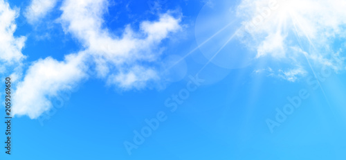 Quadro su tela Bright sunlight bursting through soft clouds in blue sky perfect for hopeful nat