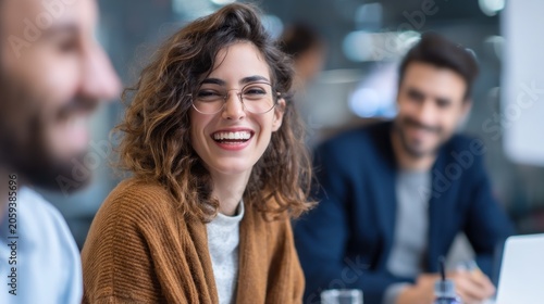 Woman laughing at business meeting