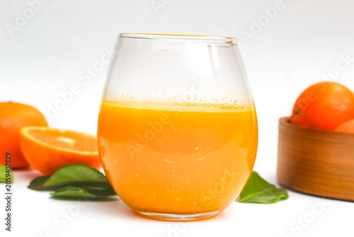 Fotografie flat lay of a glass of orange juice isolated on a white background