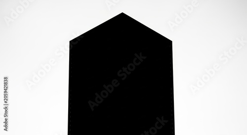 Black geometric monolith silhouette on white background.