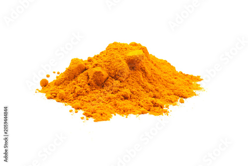 Pile of organic turmeric powder isolated on white background.