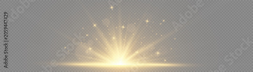 Fotografie Golden light rays rising from bottom of dark frame representing sunrise or sunse