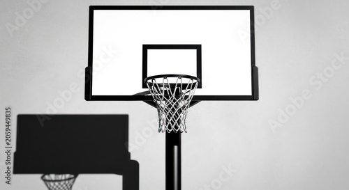 Frontal silhouette of basketball backboard and rim