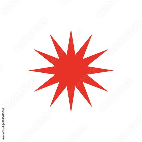 A bright red twelve-pointed star shape, isolated on a white background, representing a burst, sparkle, or decorative