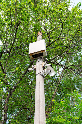 The park's utility pole is equipped with surveillance cameras and speakers.
