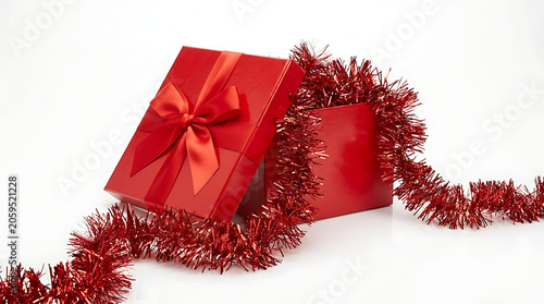 Red Gift Box With Ribbon And Tinsel On White Background
