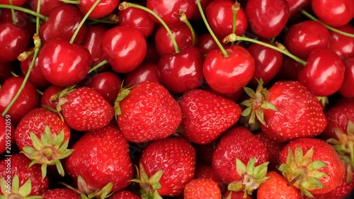Mix fresh cherry and strawberry close up, slider view