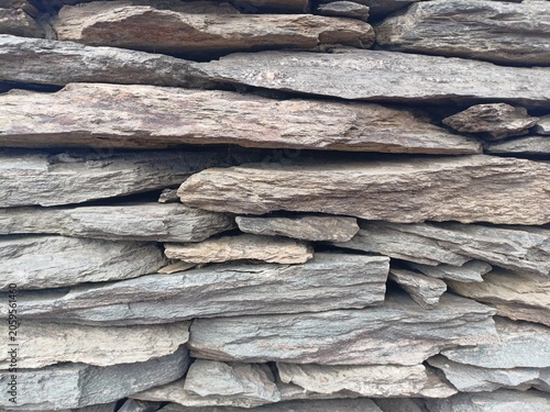 Obraz na plátně Rough grey stone slate wall texture, horizontal natural stacked flagstone claddi