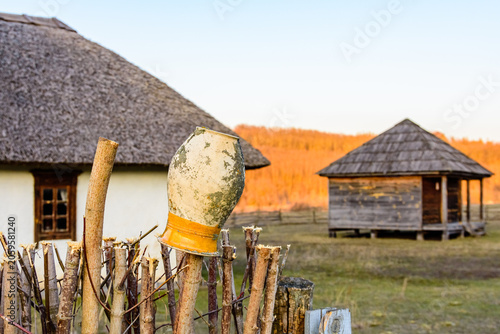 Old clay pots hanging on a dry branch