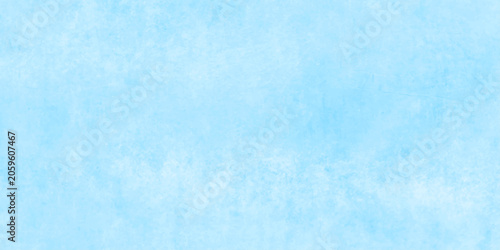 Soft textured sky-blue watercolor background with cloudy gradients, minimal abstract backdrop. blue paint concrete wall texture.