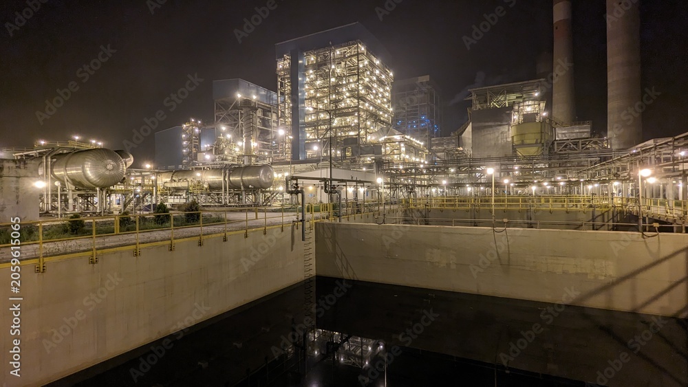 Naklejka premium Modern Coal Fired Power Plant and Water Treatment Facility at Night