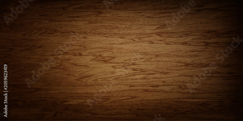 A rich, textured wooden background displays the natural grain of wood, offering a warm and earthy aesthetic.